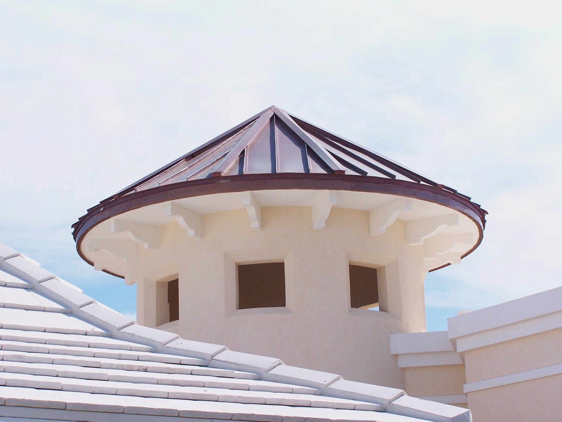 Architectural metal roof detail with copper clad cupola